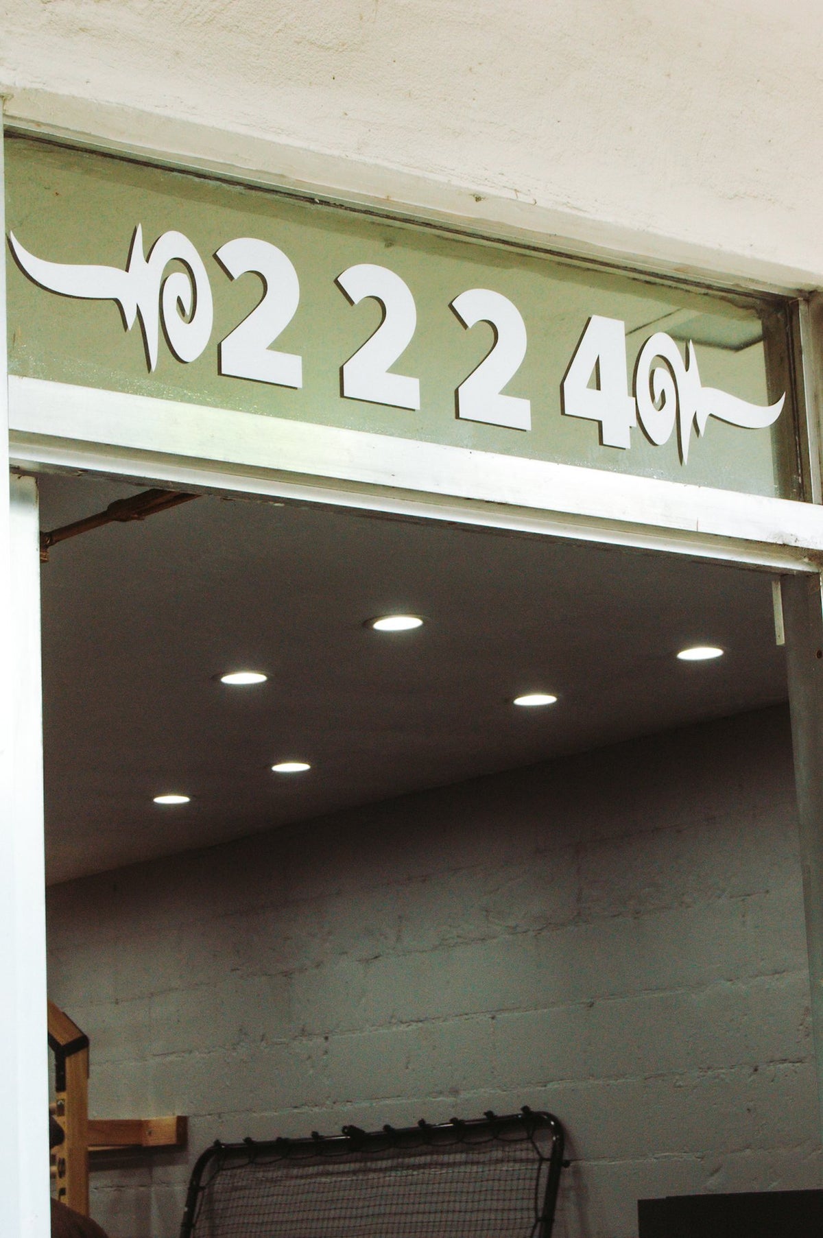 Spring Well studio entrance under the 2224 sign on 10th Street, Sacramento