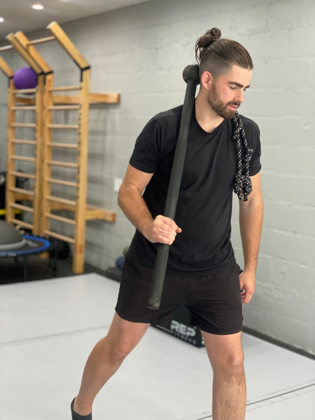 Alex Cunningham in the studio with mace and flow rope